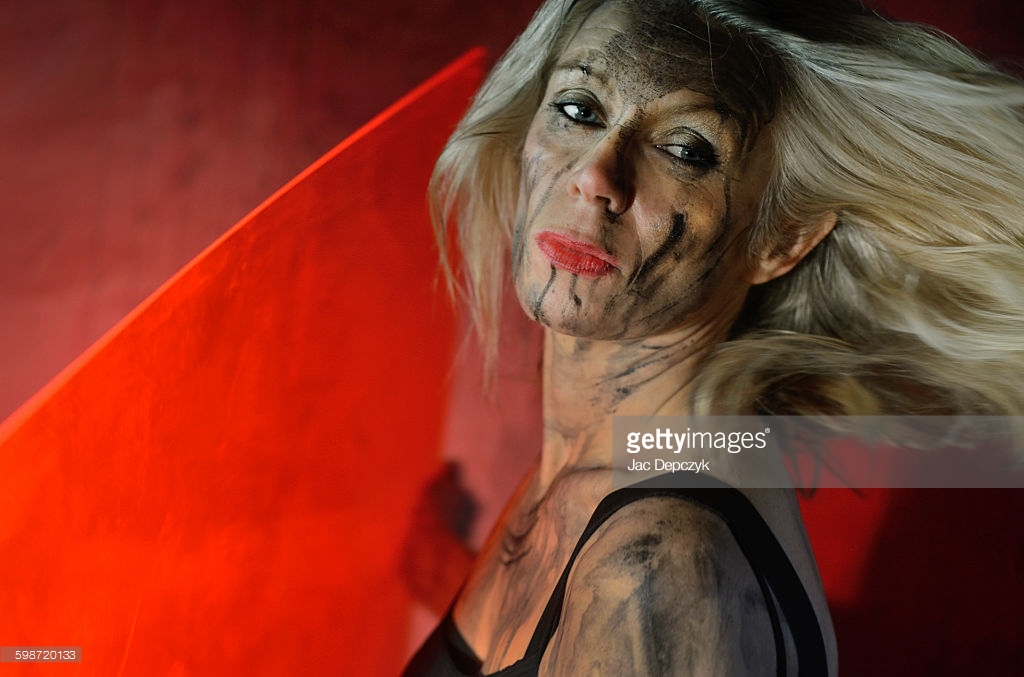 I will not fall. Warrior woman with red perspex shield Photo shoot for Getty Images - Ali Lochhead shot by Jac Depczyk in London. https://www.gettyimages.com/license/598720133