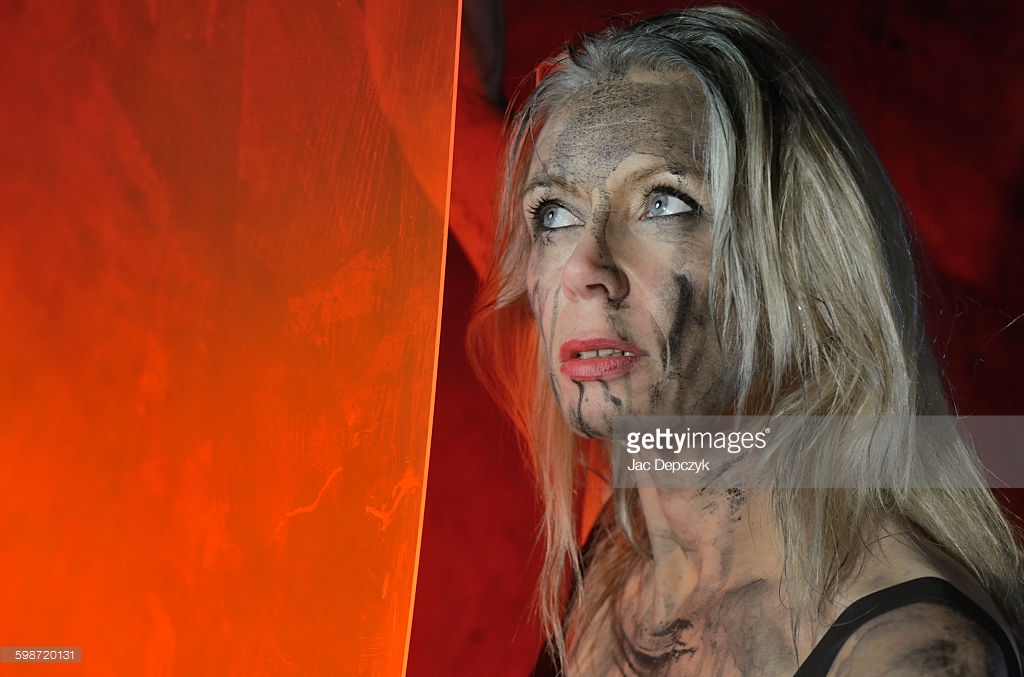 She will not give up. She can take it again and again and again. Photo shoot for Getty Images - Ali Lochhead in black camouflage paint with a red perspex shield, shot by Jac Depczyk in London. https://www.gettyimages.com/license/598720131